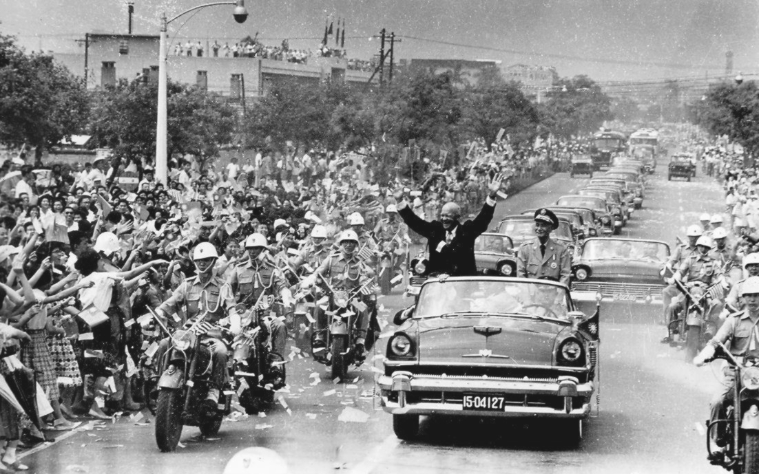 With Chiang Kai-shek, President Dwight D. Eisenhower waved to crowds during his visit to Taipei in June 1960.