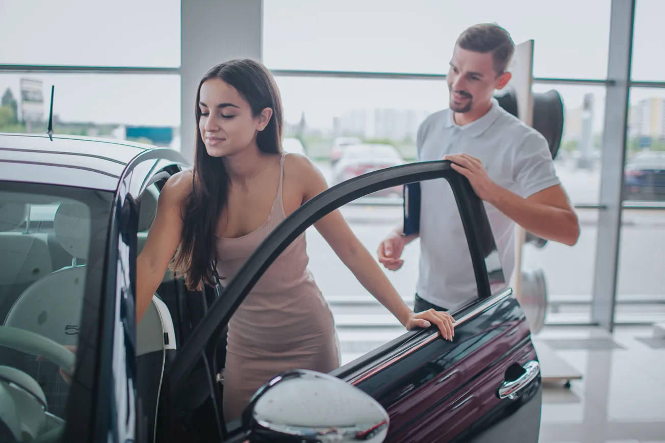 Young lady buying a car