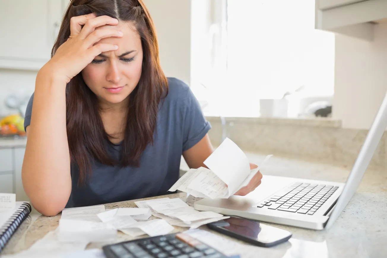 stressed lady reviewing bills