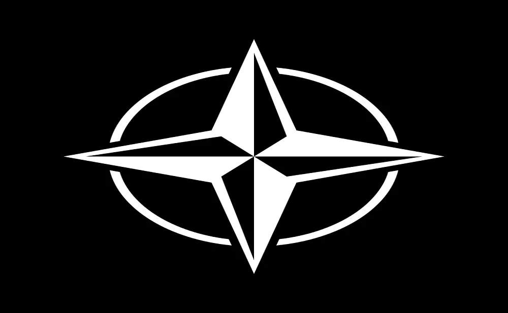 NATO Emblem Aserth, CC BY-SA 3.0 <https://creativecommons.org/licenses/by-sa/3.0>, via Wikimedia Commons