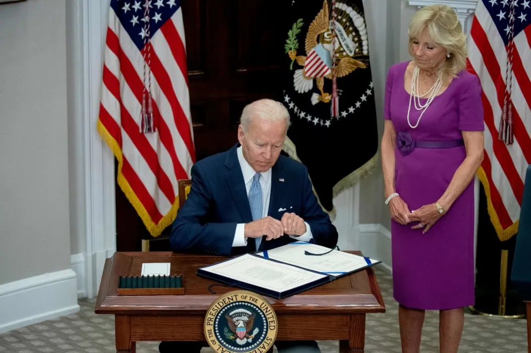 President Biden signs the Bipartisan Safer Communities Act into law, June 25, 2022. (STEFANI REYNOLDS/AFP via Getty Images)