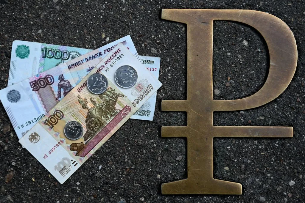 This picture in Moscow, shows Russian ruble coins and banknotes pictured next to the Russian ruble sign.