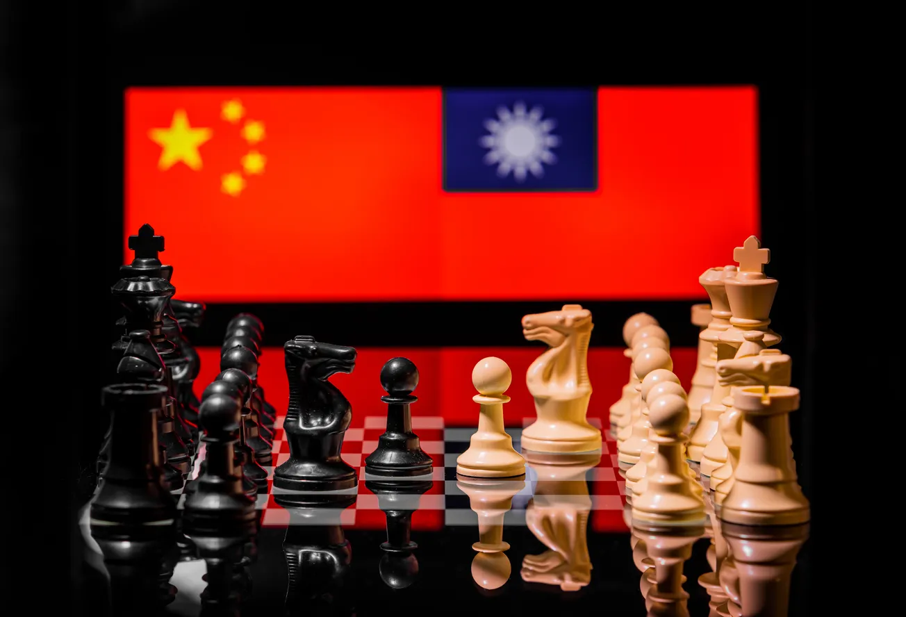 Chess board in front of Chinese and Taiwanese flags